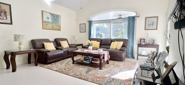 living room featuring tile patterned flooring and vaulted ceiling