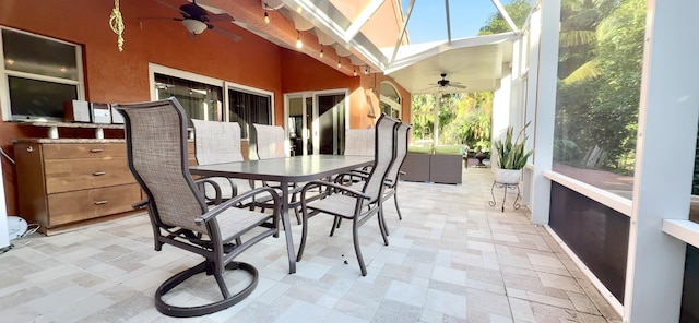 sunroom / solarium featuring ceiling fan