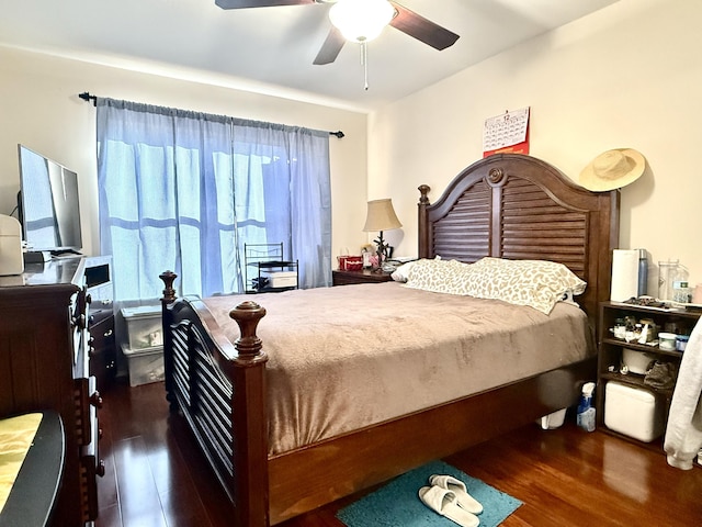 bedroom with ceiling fan and dark wood-type flooring