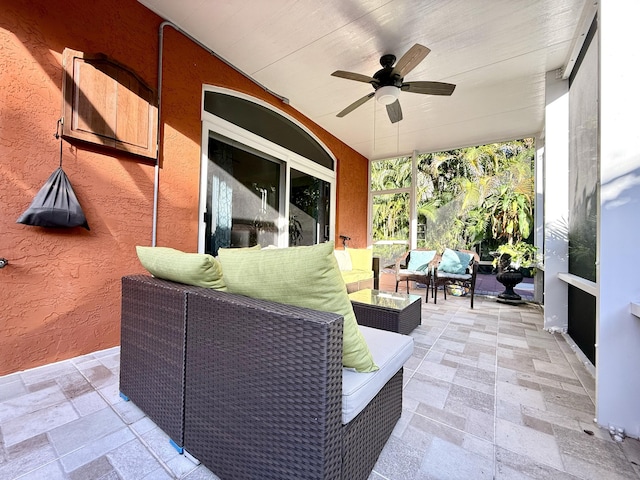 view of patio with outdoor lounge area and ceiling fan