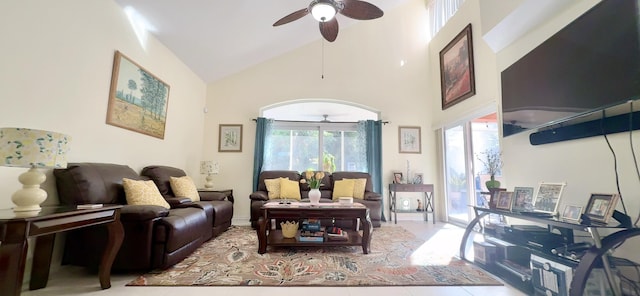 tiled living room featuring high vaulted ceiling and ceiling fan