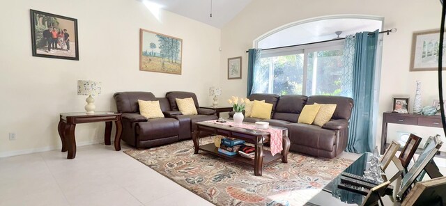 living room featuring light tile patterned flooring and lofted ceiling