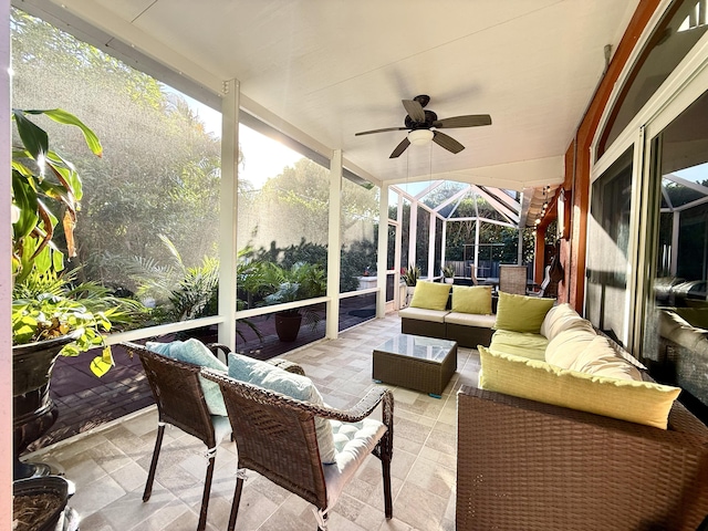 sunroom / solarium featuring ceiling fan