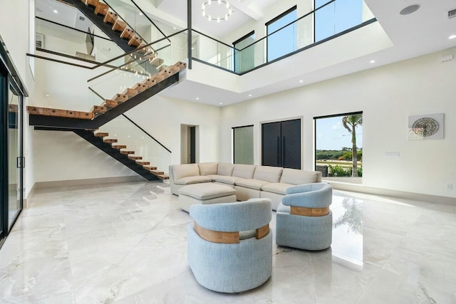 living room featuring a high ceiling