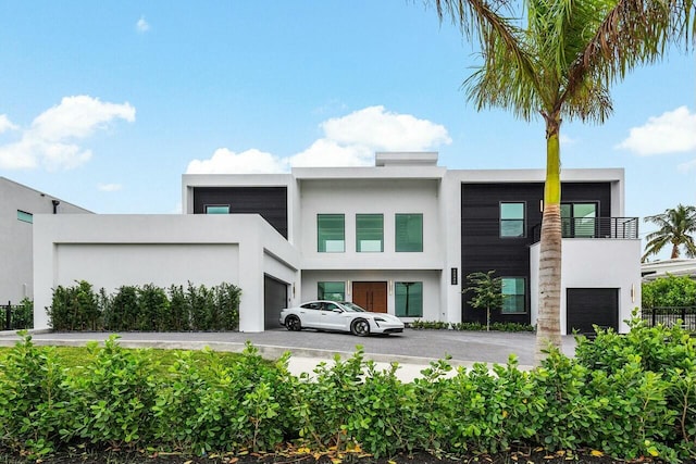 contemporary house with a balcony and a garage