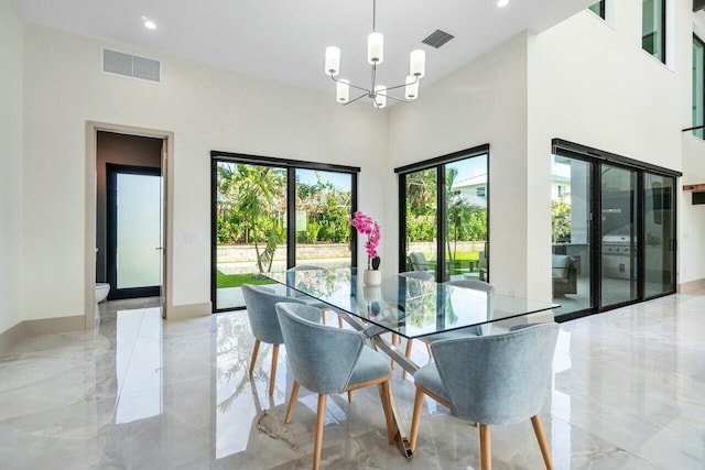 dining room with a notable chandelier