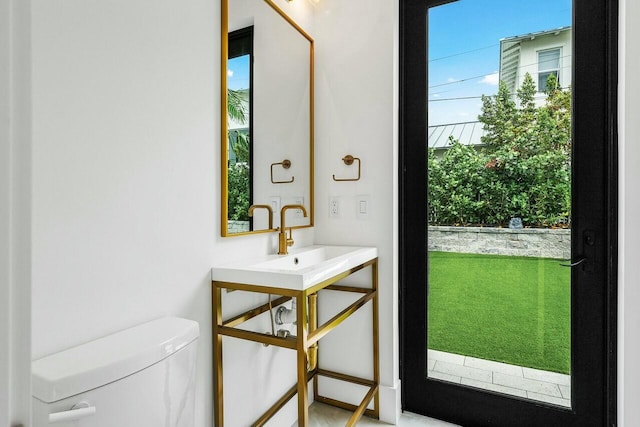 bathroom featuring toilet and sink