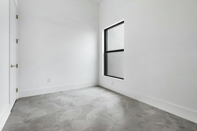 unfurnished room featuring plenty of natural light