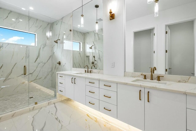 bathroom featuring vanity and an enclosed shower