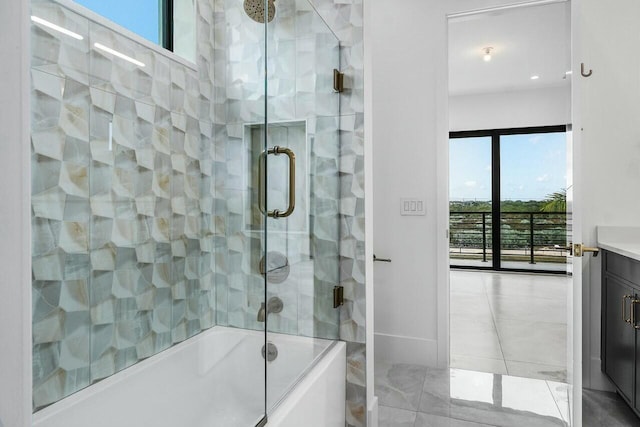 bathroom featuring vanity and bath / shower combo with glass door