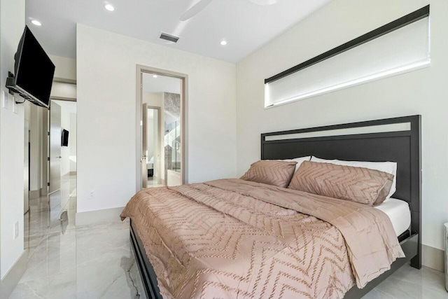 bedroom featuring ensuite bath and ceiling fan