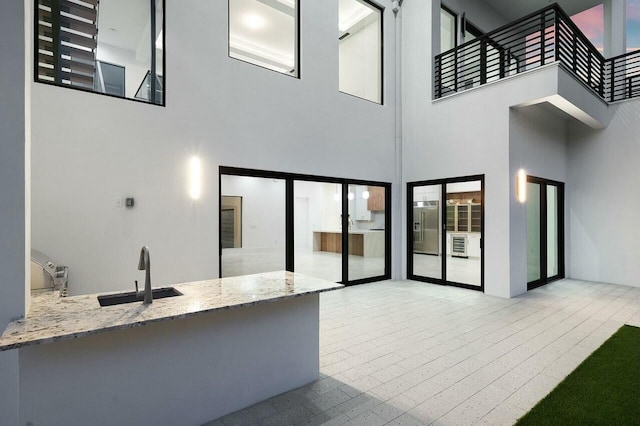 view of patio / terrace with sink and a balcony