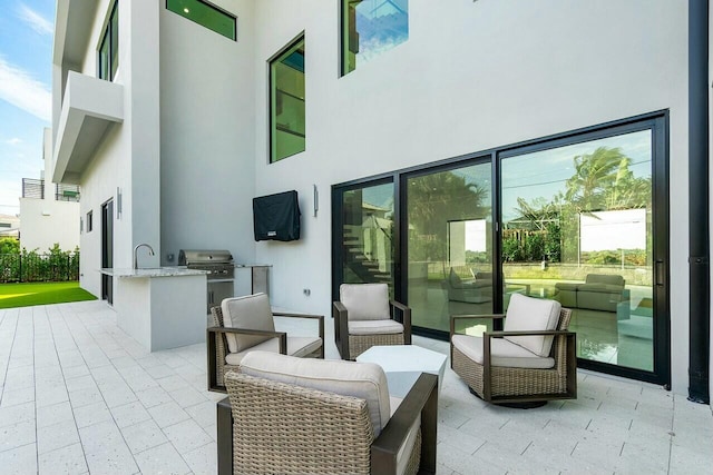 view of patio featuring exterior kitchen