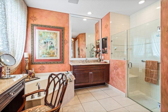 bathroom featuring tile patterned flooring, vanity, and separate shower and tub