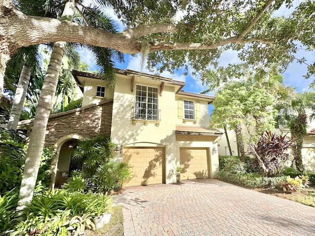 mediterranean / spanish house with a garage