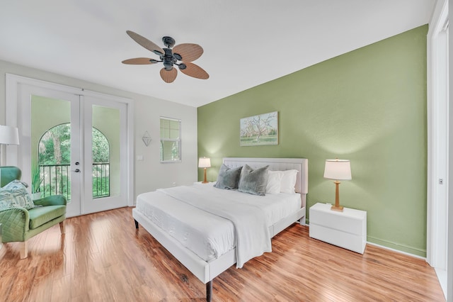 bedroom featuring ceiling fan, access to exterior, light wood-type flooring, and french doors