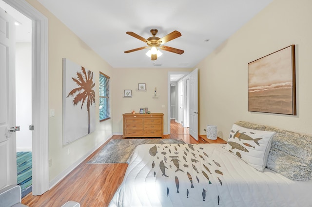 bedroom with light hardwood / wood-style flooring and ceiling fan