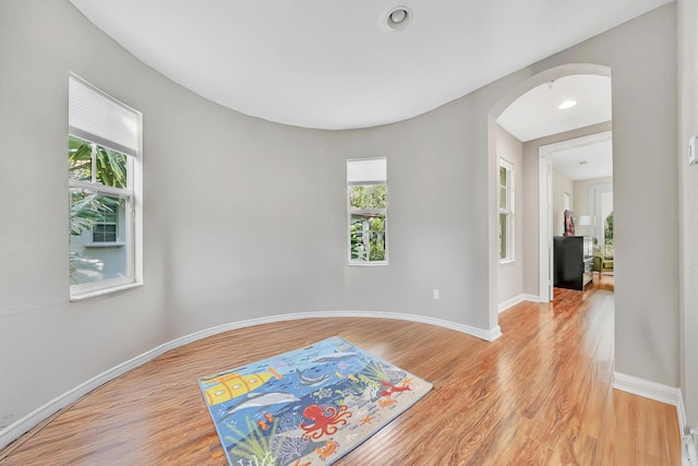 spare room with light hardwood / wood-style flooring