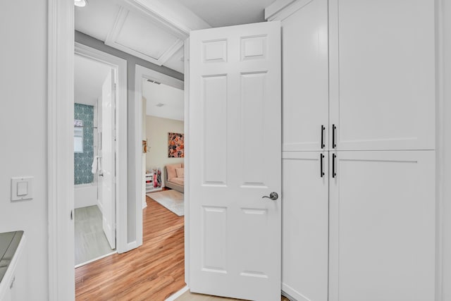 hallway with light wood-type flooring