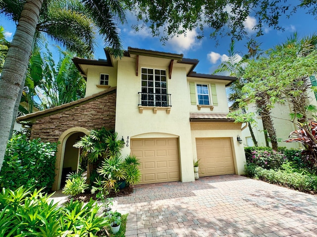 mediterranean / spanish-style house featuring a garage