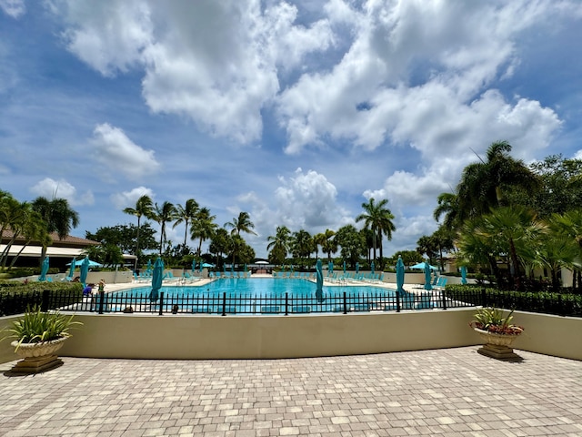 view of swimming pool with a patio