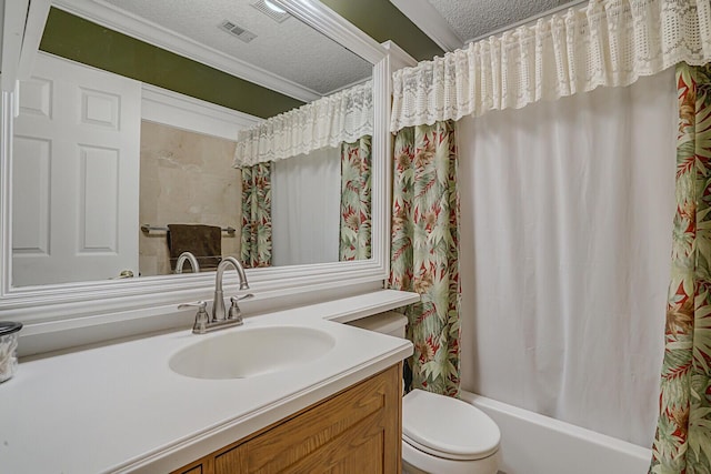 full bathroom featuring vanity, a textured ceiling, shower / bath combo with shower curtain, crown molding, and toilet