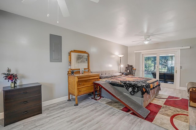 bedroom with access to outside, electric panel, ceiling fan, and light hardwood / wood-style flooring