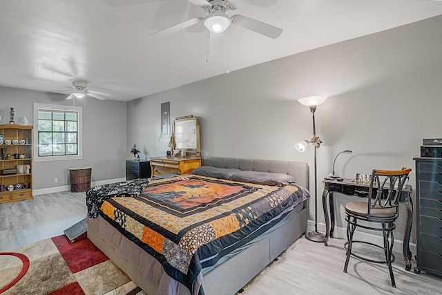 bedroom with ceiling fan and light hardwood / wood-style floors