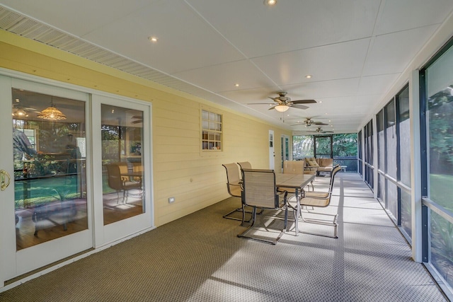 sunroom / solarium featuring ceiling fan