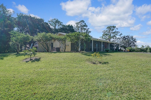 view of yard featuring a sunroom