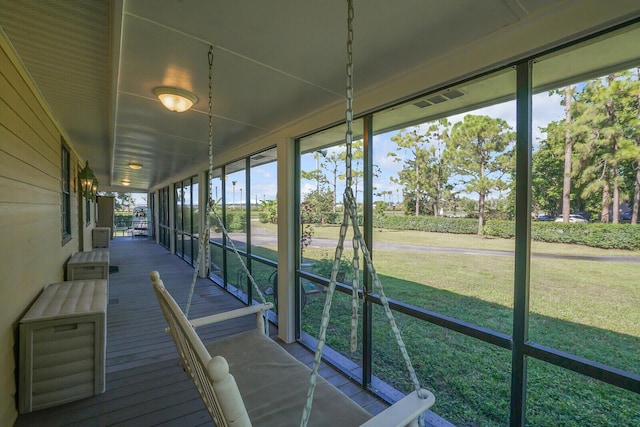 unfurnished sunroom featuring a wealth of natural light