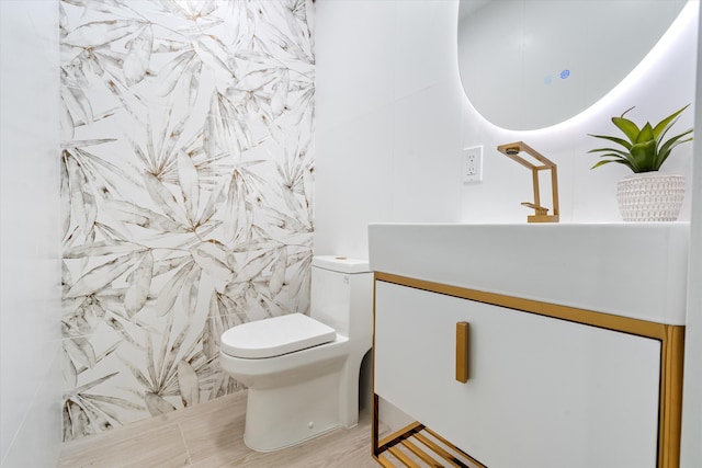 bathroom with vanity and toilet