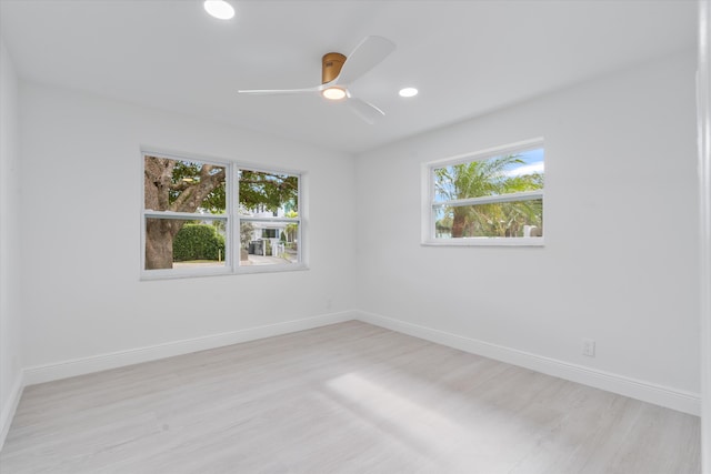 spare room with ceiling fan and light hardwood / wood-style flooring