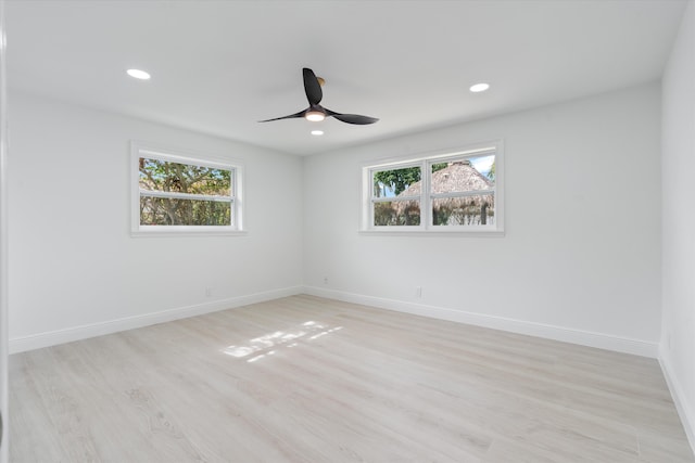 empty room featuring light hardwood / wood-style flooring and ceiling fan