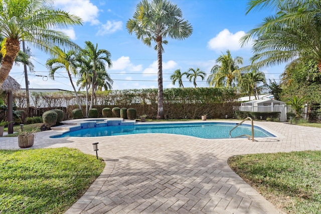 view of swimming pool featuring a patio area