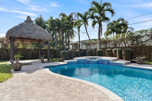 view of pool with a gazebo, an in ground hot tub, and a patio