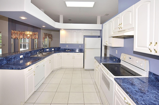 kitchen with light tile patterned floors, white appliances, white cabinetry, and a notable chandelier