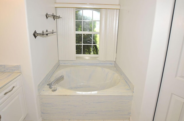 bathroom with tiled tub