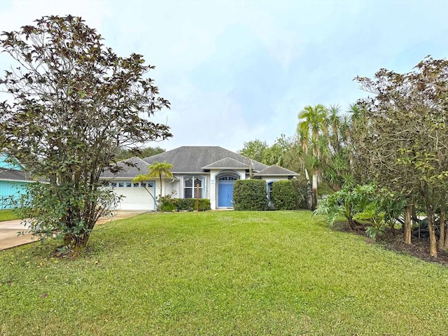 single story home with a front lawn and a garage