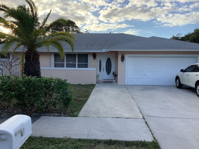 single story home with a garage