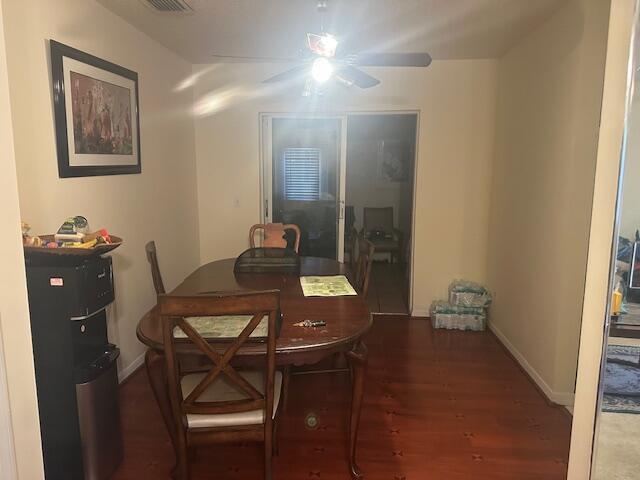 dining room with dark hardwood / wood-style flooring