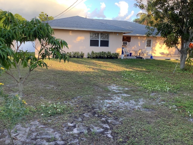 exterior space featuring a yard and a patio