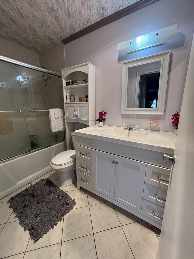 full bathroom featuring tile patterned flooring, vanity, toilet, and enclosed tub / shower combo