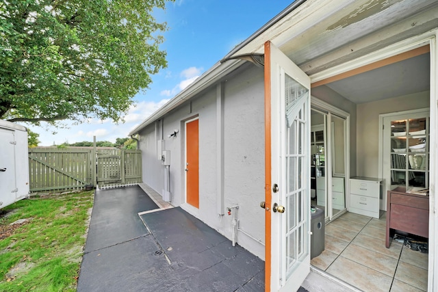 view of side of property with a patio