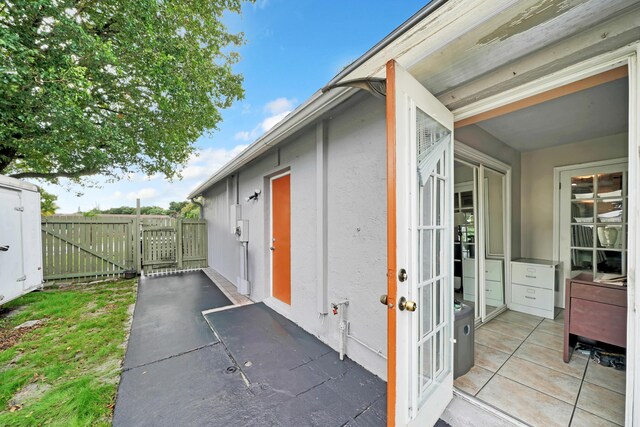 view of side of property with a patio