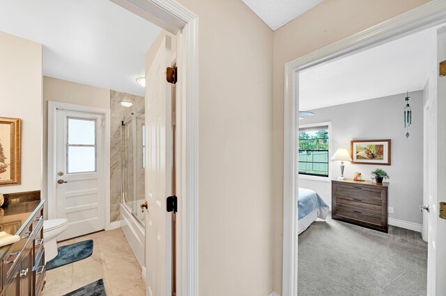 bedroom featuring ceiling fan, carpet, and a closet