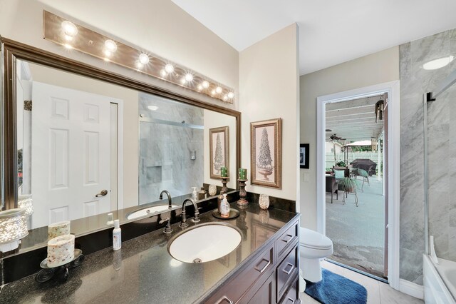 full bathroom with enclosed tub / shower combo, vanity, toilet, and tile patterned flooring