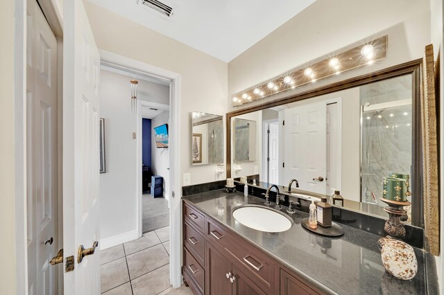 bathroom featuring vanity, toilet, and tile patterned flooring