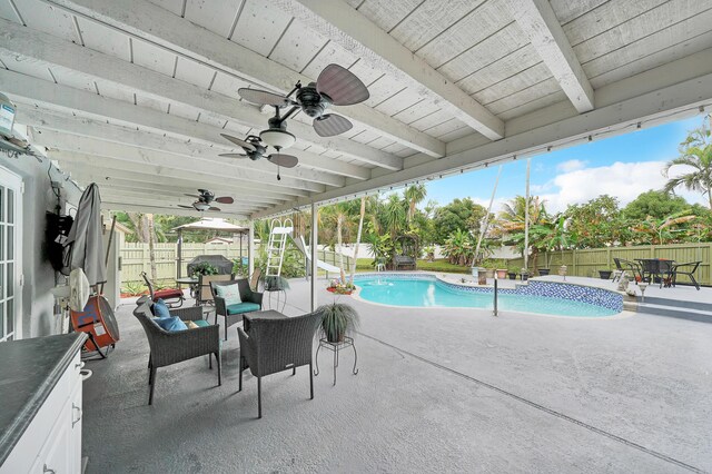 view of patio with french doors, ceiling fan, a grill, and sink