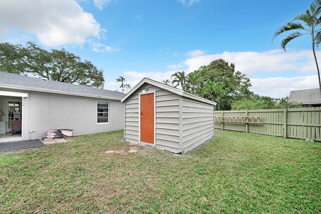 exterior space with a patio area and a lawn